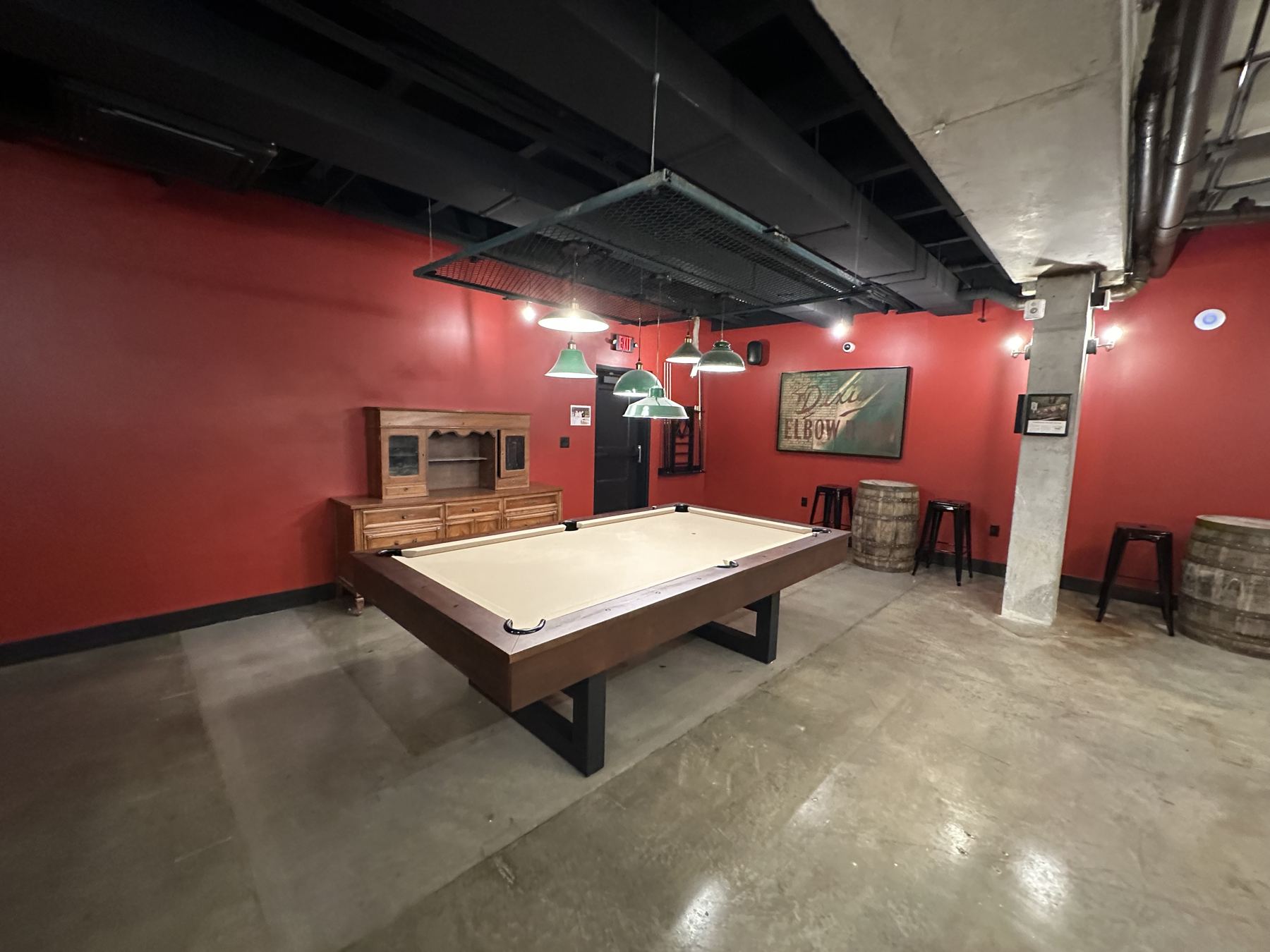 Pool table in the Neighborhood House Speakeasy game room