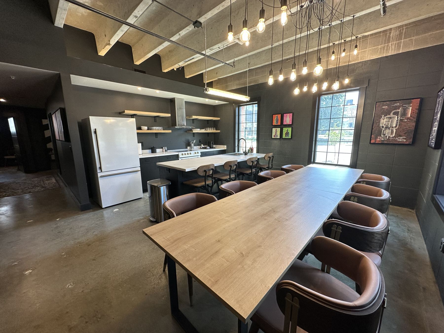 Suite dining table under pendant lights