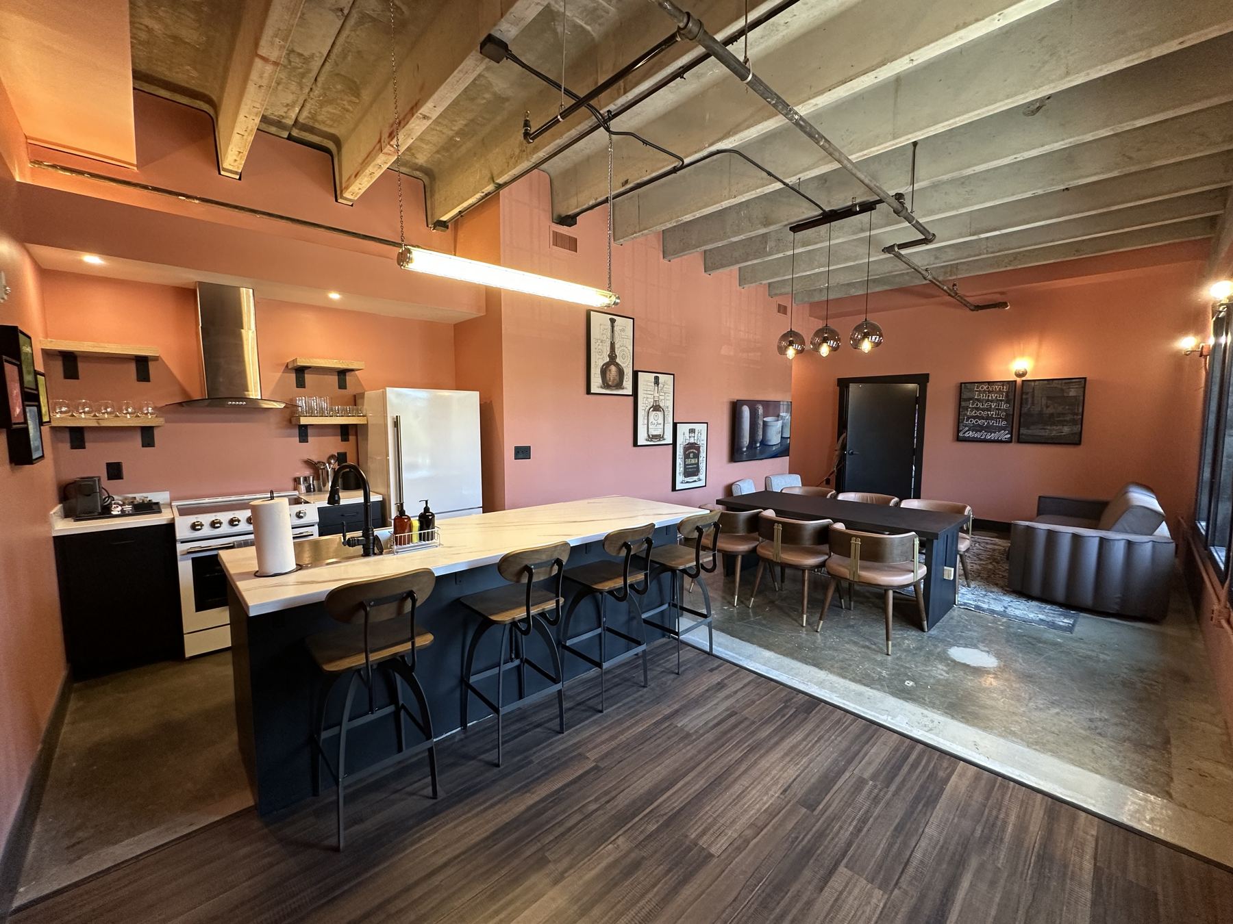 Open suite living area with full kitchen and dining island